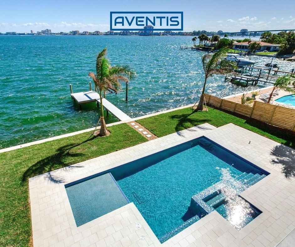 This custom backyard features a sleek pool and spa overlooking the Intracoastal, designed for luxury and relaxation. #AventisHomes
#WaterfrontDesign #LuxuryOutdoorLiving #ModernPoolDesign #BackyardGoals