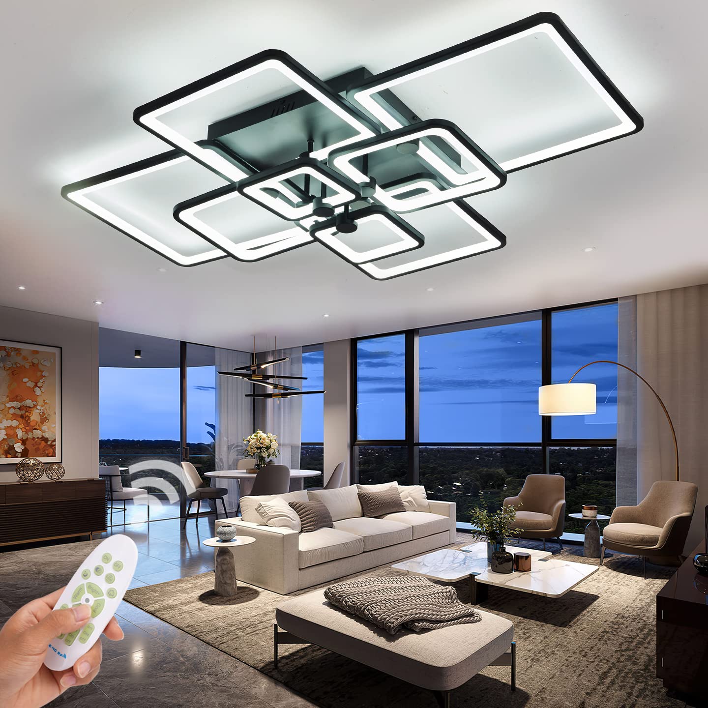 Modern living room featuring a stylish ceiling fan with integrated LED lighting, remote control in hand, large windows showcasing an evening view, and contemporary furniture including a sofa, chairs, and decorative elements.