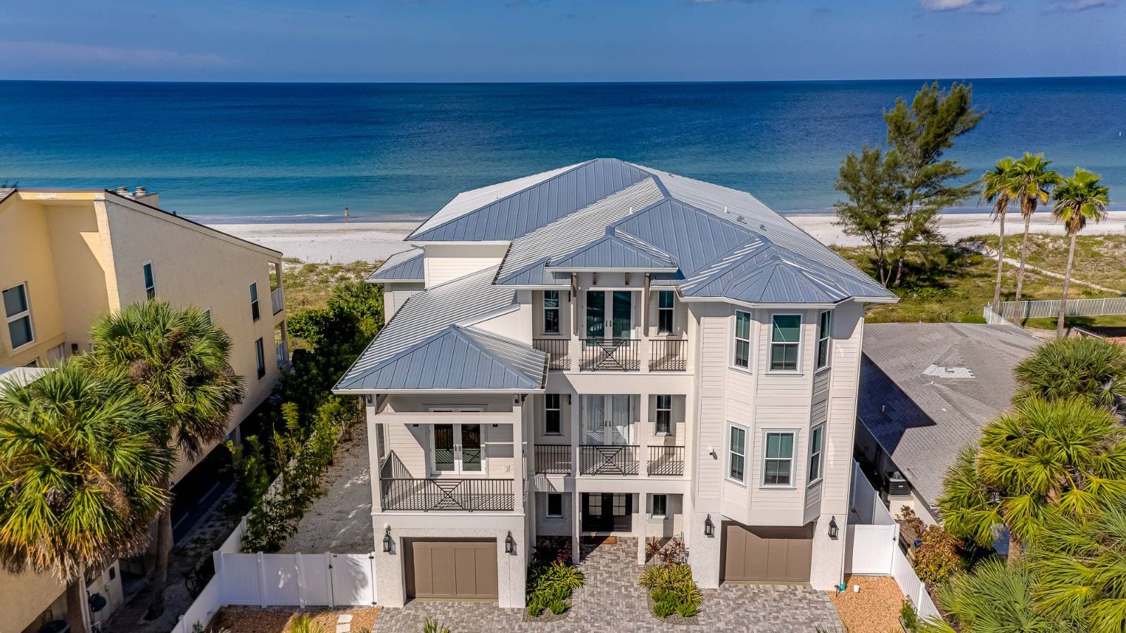 an aerial view of a beachfront home in florida