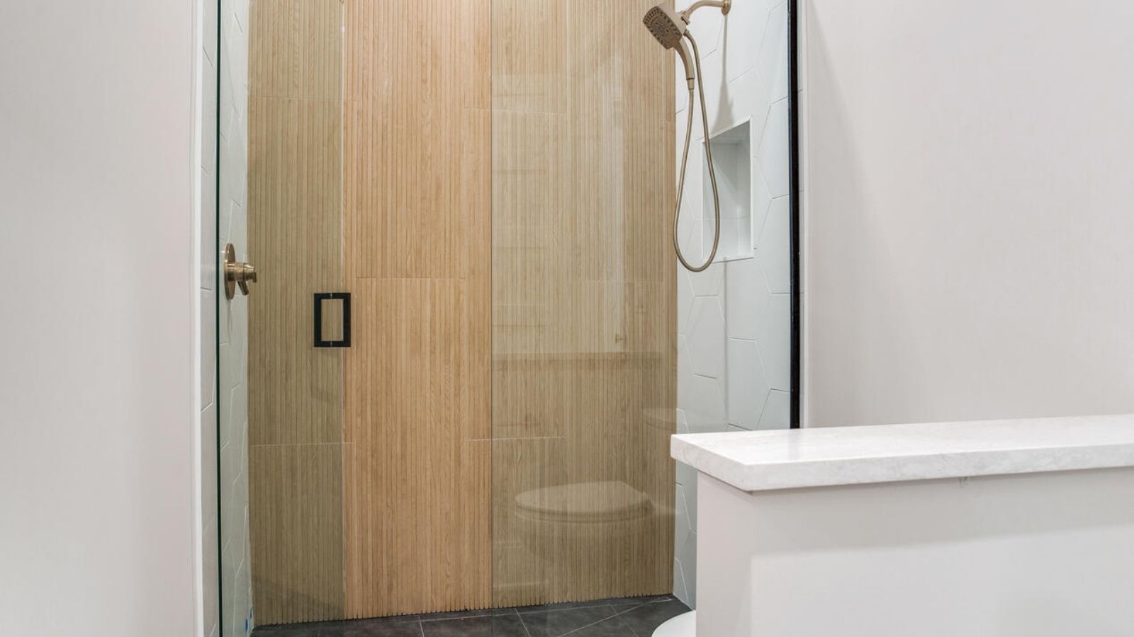a modern bathroom with a glass shower door