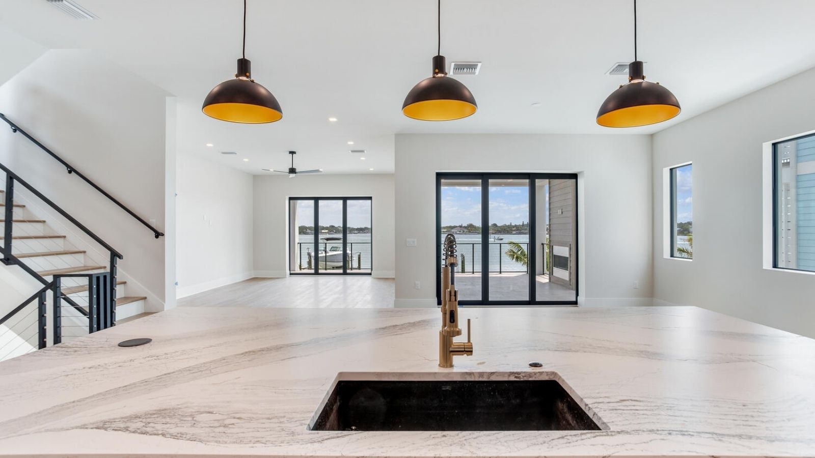 a kitchen with marble counter tops and stainless steel appliances