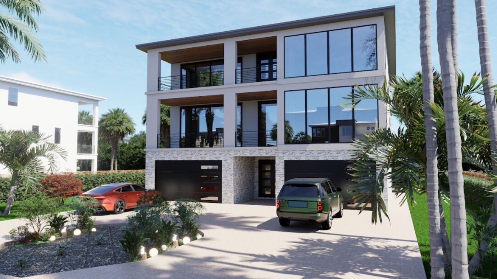 Three-story coastal home with open balconies, large glass windows, and a landscaped driveway with palm trees.